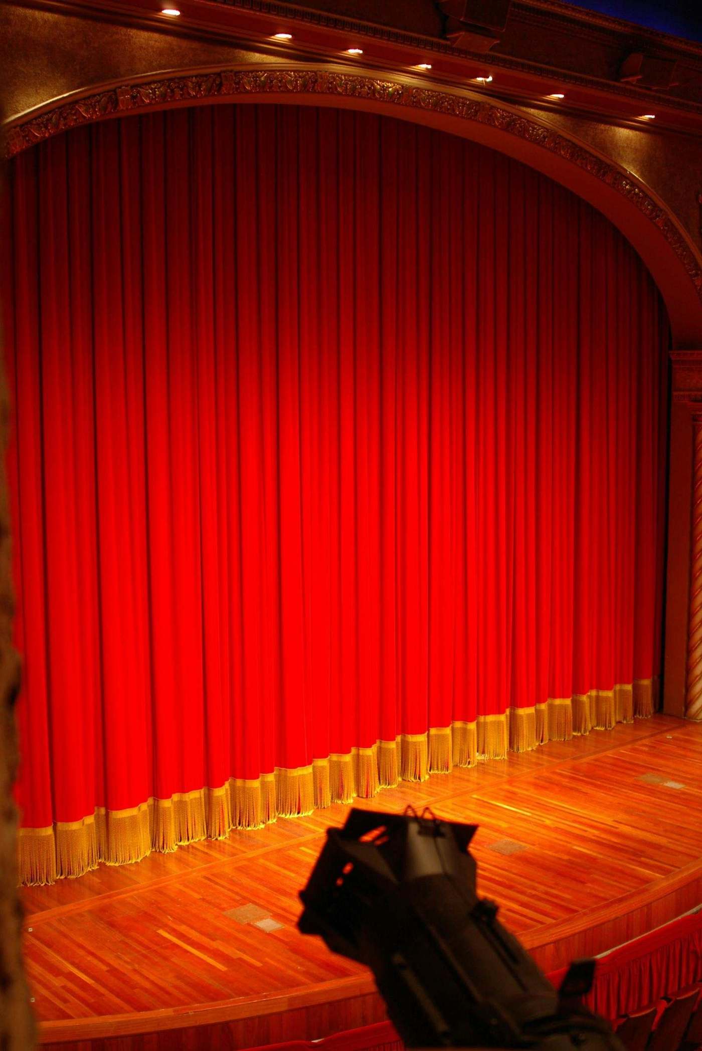 A closed red stage curtain