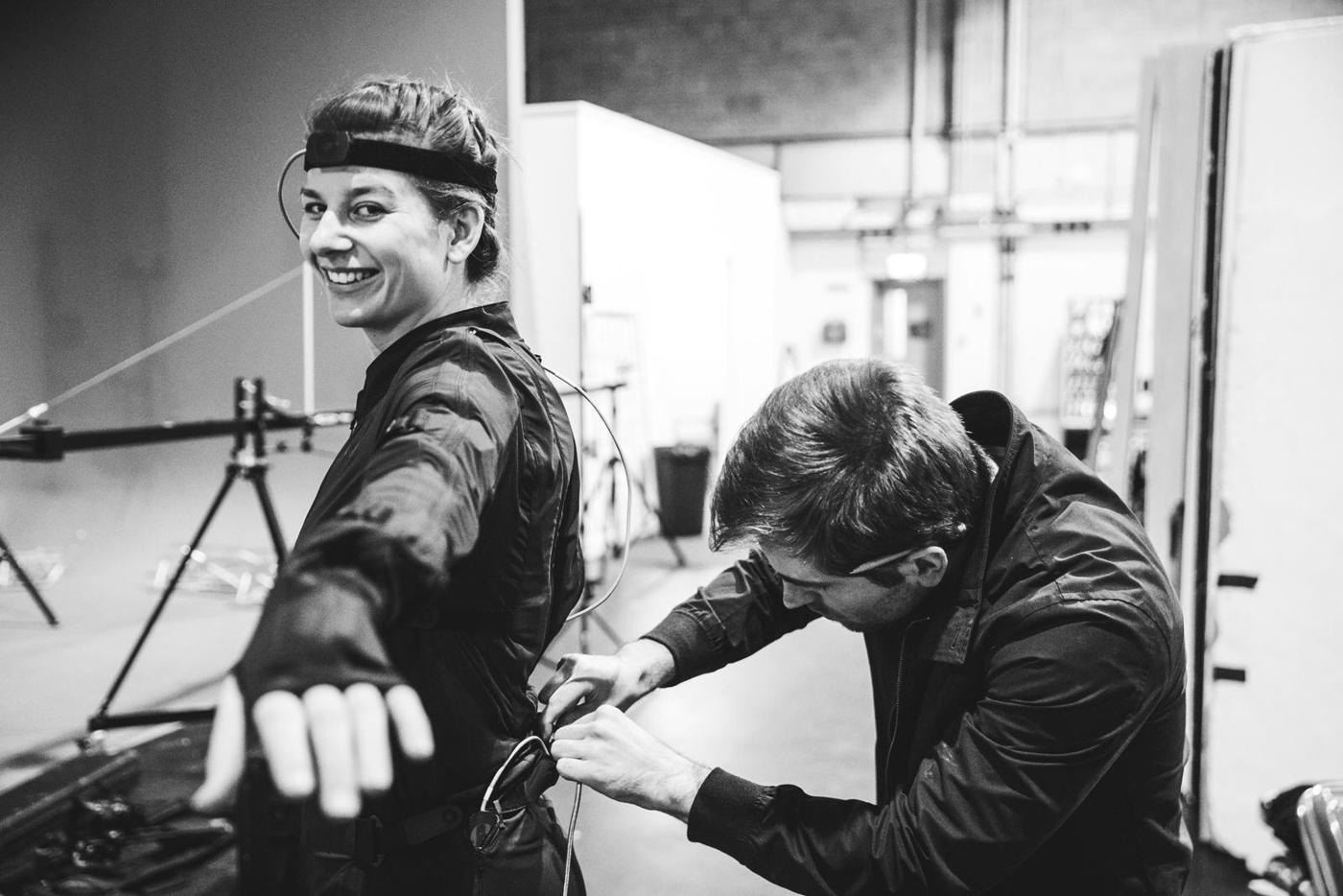 A camera operator and a director reviewing a shot