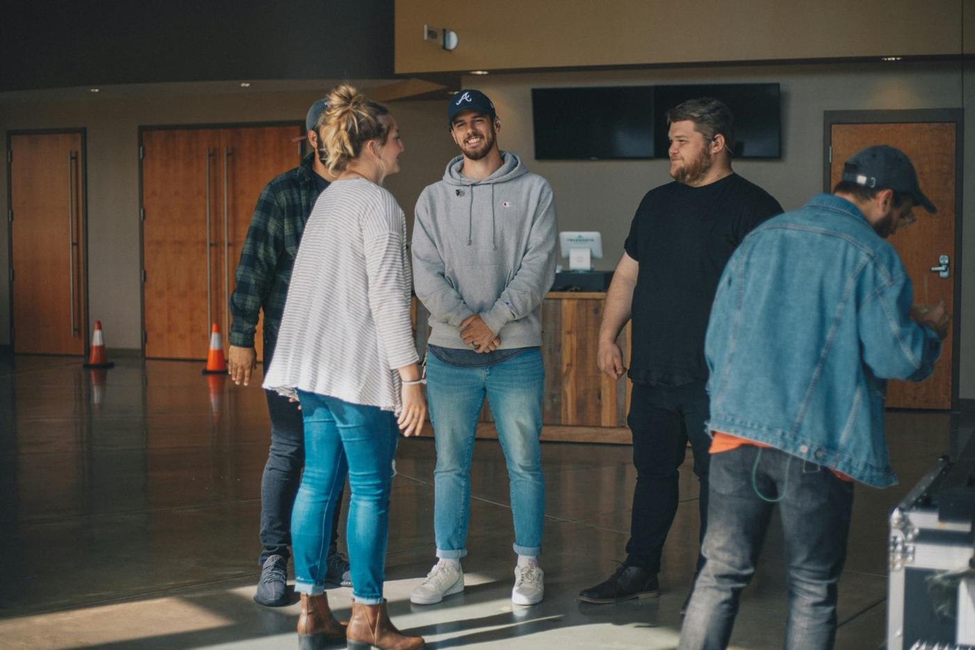 People talking in a theatre foyer